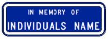 Image of a typical WSDOT memorial sign plaque.  Sign is white text on a blue background and reads "in memory of individual's name".