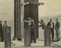Workmen setting tower base plate, August 1939 WSDOT